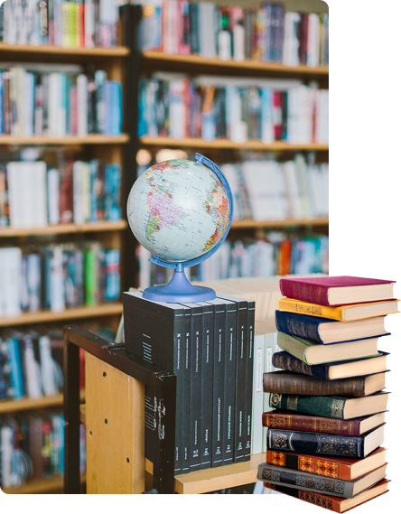 A stack of books with a globe on top.