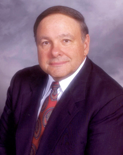 Portrait of a man in a suit and tie.